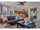 Spacious living room with leather sectional and adjacent kitchen at 32029 N 19Th Ln, Phoenix, AZ 85085