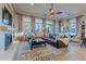 Spacious living room boasts a brown leather sectional and a large window at 32029 N 19Th Ln, Phoenix, AZ 85085