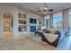 Spacious living room with a fireplace and built-in shelving at 32029 N 19Th Ln, Phoenix, AZ 85085