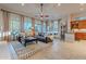 Open living space with a leather sectional and views into the kitchen at 32029 N 19Th Ln, Phoenix, AZ 85085