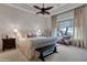 Relaxing main bedroom with plush bedding and ceiling fan at 32029 N 19Th Ln, Phoenix, AZ 85085