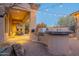 Outdoor kitchen with built-in grill and seating area at 32029 N 19Th Ln, Phoenix, AZ 85085