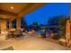 Outdoor patio with a large dining table and chairs, adjacent to the pool and backyard at 32029 N 19Th Ln, Phoenix, AZ 85085