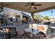 Relaxing covered patio with wicker furniture and ceiling fan at 32029 N 19Th Ln, Phoenix, AZ 85085