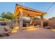 Covered patio with wicker seating and string lights for evening relaxation at 32029 N 19Th Ln, Phoenix, AZ 85085