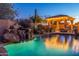 Relaxing pool and spa area with a waterfall feature and comfortable lounge chairs at 32029 N 19Th Ln, Phoenix, AZ 85085