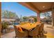 Relaxing poolside patio furniture, inviting pool, and desert landscaping at 32029 N 19Th Ln, Phoenix, AZ 85085