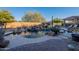 Inviting pool with waterfall feature, spacious patio, and covered seating area at 32029 N 19Th Ln, Phoenix, AZ 85085