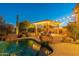 Stunning pool and spa area with a pergola, comfortable lounge chairs, and string lights at 32029 N 19Th Ln, Phoenix, AZ 85085