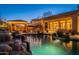 Stunning pool and spa at night with lights and waterfall at 32029 N 19Th Ln, Phoenix, AZ 85085