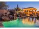 Inviting pool with a waterfall, a pergola, and lounge chairs at 32029 N 19Th Ln, Phoenix, AZ 85085