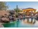 Relaxing pool and spa area with a waterfall feature, pergola, and lounge chairs at 32029 N 19Th Ln, Phoenix, AZ 85085