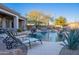 Relaxing pool area with lounge chairs and desert landscape at 32029 N 19Th Ln, Phoenix, AZ 85085