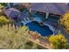 Expansive pool and spa with a rock waterfall and outdoor kitchen at 32029 N 19Th Ln, Phoenix, AZ 85085