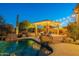 Stunning pool and spa area with a pergola and string lights at dusk at 32029 N 19Th Ln, Phoenix, AZ 85085