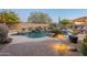 Inviting pool and patio area with a waterfall and brick walkways at 32029 N 19Th Ln, Phoenix, AZ 85085