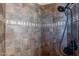 Tiled shower with decorative accents at 32029 N 19Th Ln, Phoenix, AZ 85085