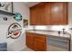 Wet bar with wood cabinets and granite countertop at 32029 N 19Th Ln, Phoenix, AZ 85085