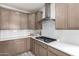 Modern kitchen features gas cooktop, ample cabinetry, and white subway tile backsplash at 32040 N Lisadre Ln, San Tan Valley, AZ 85144