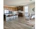 Open kitchen and dining area with a large island, stainless steel appliances, and a dining table with seating for six at 32040 N Lisadre Ln, San Tan Valley, AZ 85144