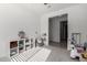 Spacious playroom with built-in shelving and hallway access at 32040 N Lisadre Ln, San Tan Valley, AZ 85144