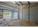 Empty barn stall with metal gate and flooring at 3464 N Ashbrook St, Mesa, AZ 85213