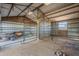 Barn stall with metal gate and hay at 3464 N Ashbrook St, Mesa, AZ 85213