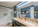 Bathroom with granite double vanity, subway tile shower, and modern fixtures at 3464 N Ashbrook St, Mesa, AZ 85213