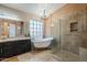 Bathroom with walk-in shower, soaking tub, and granite vanity at 3464 N Ashbrook St, Mesa, AZ 85213