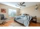 Bright bedroom with wood floors and ceiling fan at 3464 N Ashbrook St, Mesa, AZ 85213