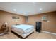 Basement bedroom with tiled floors and mini fridge at 3464 N Ashbrook St, Mesa, AZ 85213