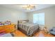 Cozy bedroom with ceiling fan and wood flooring at 3464 N Ashbrook St, Mesa, AZ 85213