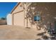 Tan garage with additional storage and a separate door at 3464 N Ashbrook St, Mesa, AZ 85213