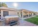 Relaxing hot tub on brick patio, near covered seating area at 3464 N Ashbrook St, Mesa, AZ 85213