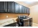 Laundry room with granite countertop and modern appliances at 3464 N Ashbrook St, Mesa, AZ 85213