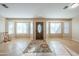 Bright living room with tile floors and large windows at 3464 N Ashbrook St, Mesa, AZ 85213