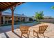 Relaxing pool area with covered patio and comfortable chairs at 3464 N Ashbrook St, Mesa, AZ 85213