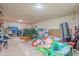 Unfinished storage room with shelving and various items at 3464 N Ashbrook St, Mesa, AZ 85213