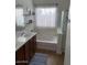 Clean bathroom with double vanity, soaking tub, and shower at 35801 N Zachary Rd, San Tan Valley, AZ 85144