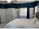 Comfortable bedroom with ample natural light and ceiling fan at 35801 N Zachary Rd, San Tan Valley, AZ 85144