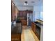 Kitchen with dark wood cabinets, granite counters, and stainless steel appliances at 35801 N Zachary Rd, San Tan Valley, AZ 85144