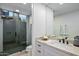 Modern bathroom with walk-in shower, white vanity with marble countertop and vessel sink at 39493 N 107Th Way, Scottsdale, AZ 85262