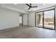 Bright bedroom features a sliding glass door to a private patio, and modern, minimalist design at 39493 N 107Th Way, Scottsdale, AZ 85262