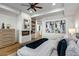 Primary bedroom with a modern fireplace, ample closet space, and contemporary decor at 39493 N 107Th Way, Scottsdale, AZ 85262