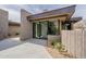 Modern home entrance with a tiled walkway, desert landscaping, and a large glass sliding door at 39493 N 107Th Way, Scottsdale, AZ 85262