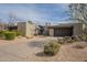 Contemporary home with desert landscaping, a private driveway, and an attached two-car garage at 39493 N 107Th Way, Scottsdale, AZ 85262