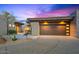 Stunning desert home boasts modern architecture, a three-car garage and xeriscaped yard at 39493 N 107Th Way, Scottsdale, AZ 85262