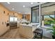 Spacious modern kitchen with custom cabinetry, stainless steel appliances, and a breakfast bar at 39493 N 107Th Way, Scottsdale, AZ 85262