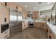 Modern kitchen with stainless steel appliances and sleek wooden cabinetry at 39493 N 107Th Way, Scottsdale, AZ 85262