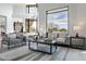 Bright living room featuring modern furniture, large windows and scenic outdoor views at 39493 N 107Th Way, Scottsdale, AZ 85262